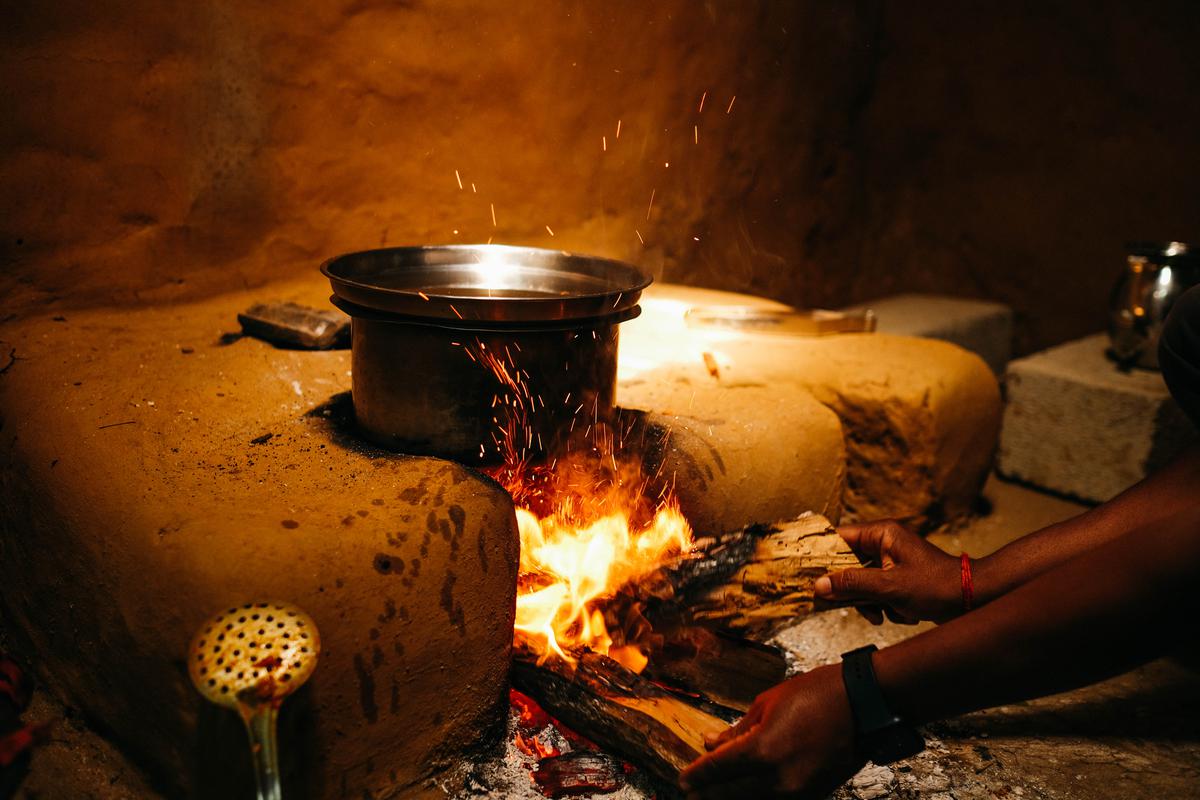 Tubers being cooked on fire in a home in Joida, Karnataka