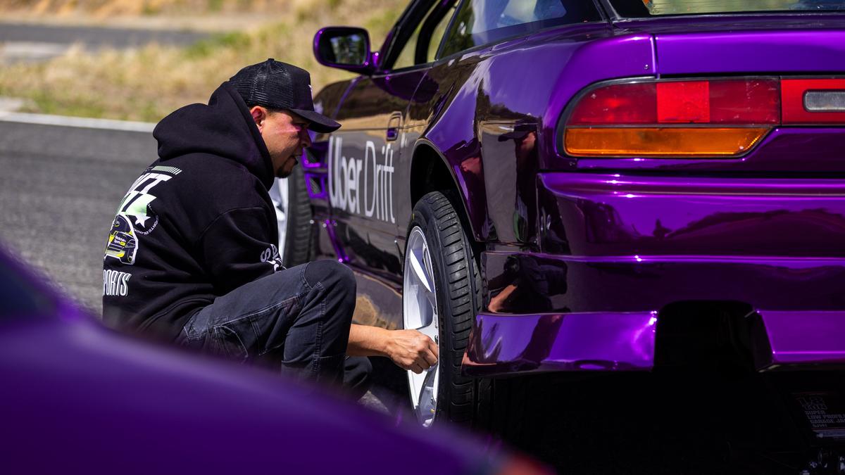 Professional drift drivers demonstrate millimetre-perfect control during a high-speed tandem run in Japan.