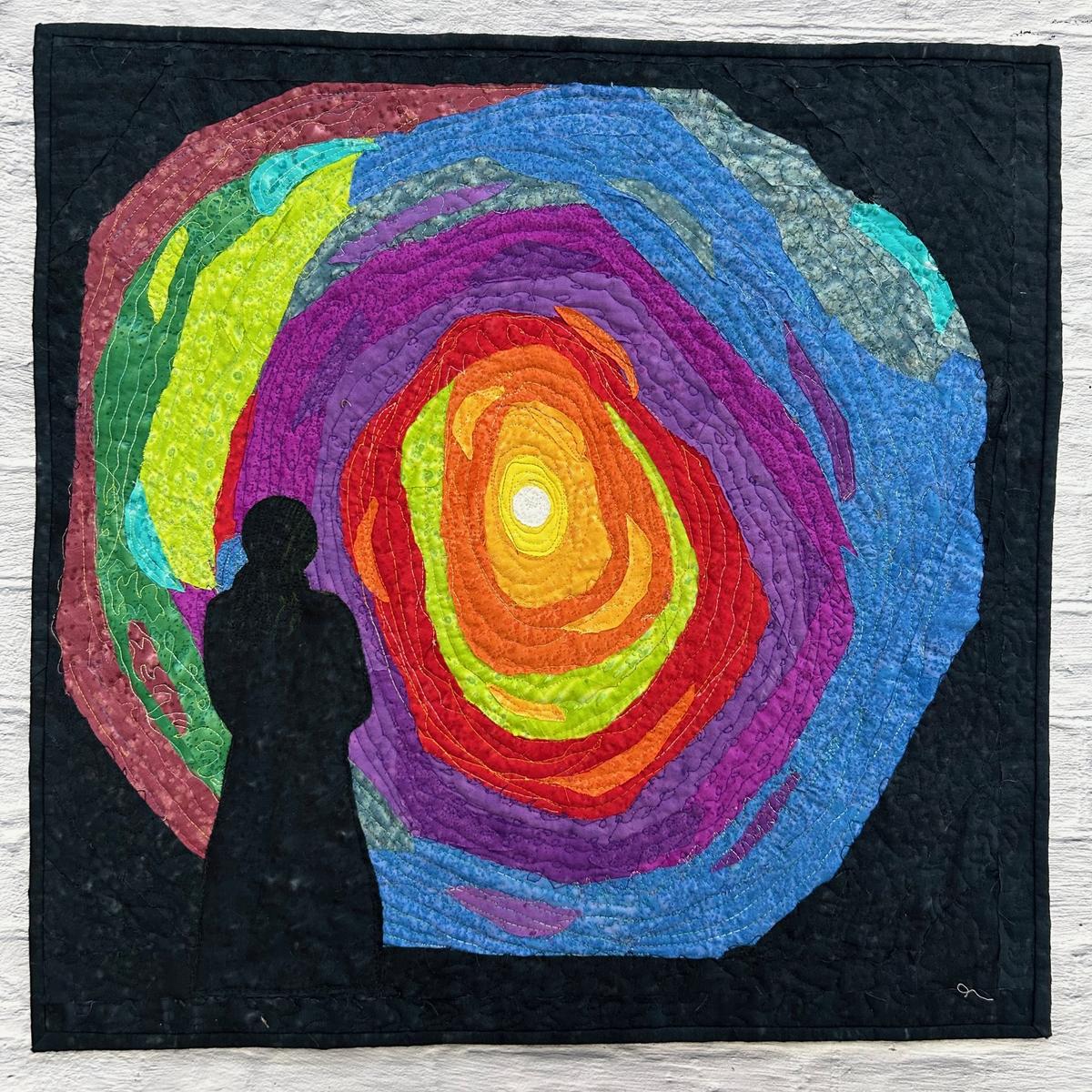 Art quilts on display  showcase diverse interpretations of  emotion and meaning.