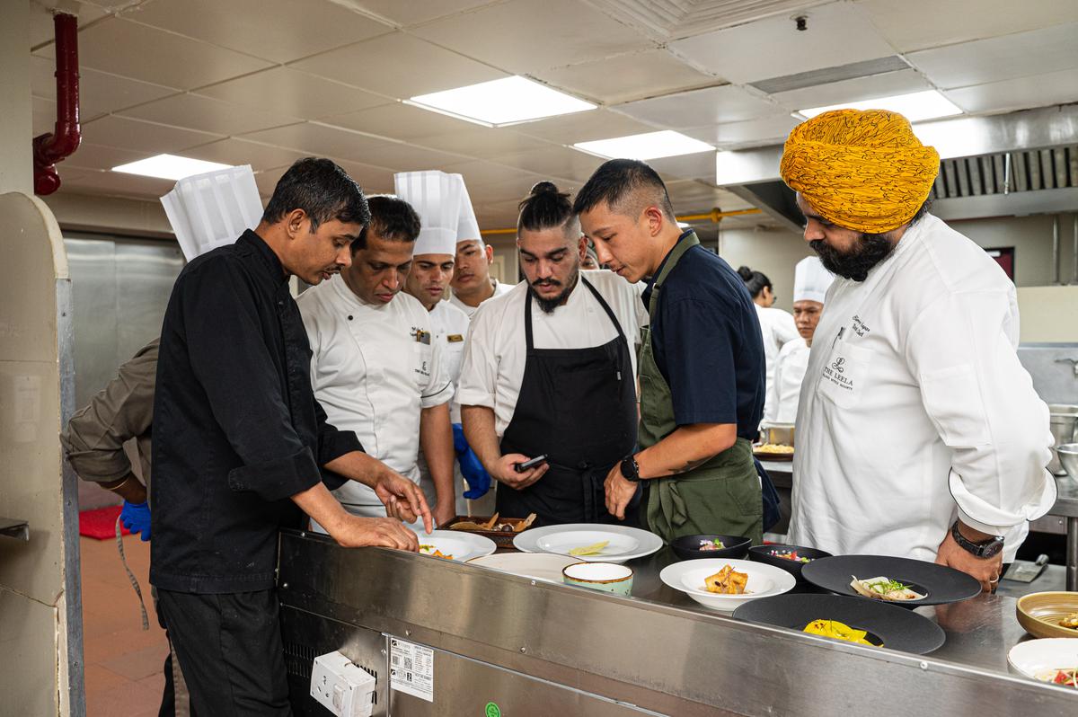 Chef Brendan Pang with the staff at The Leela Palace, Bengaluru