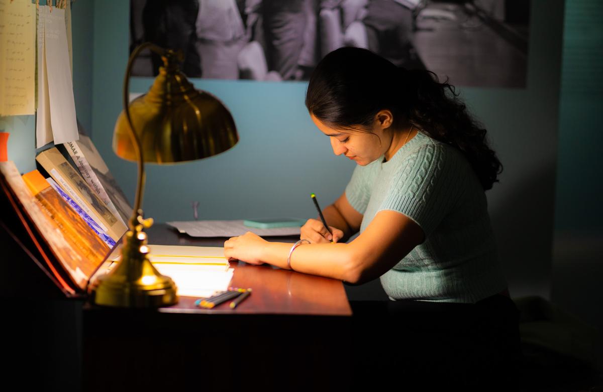 A visitor writes a letter 