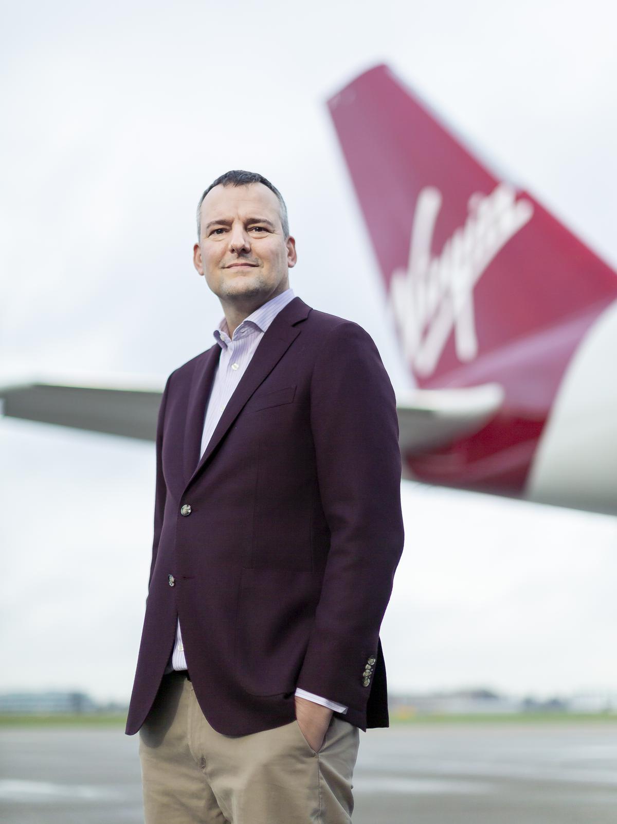 Virgin Atlantic's Chief Customer and Operations Officer Cornell Koster poses with an Airbus A350 aircraft at Heathrow Airport.