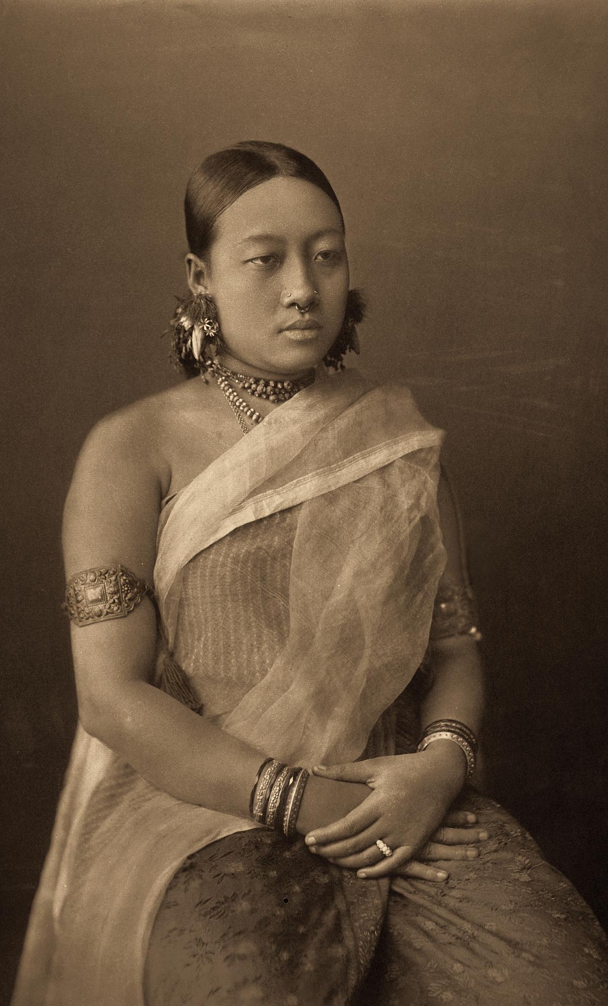 Monmohini Devi, Bir Chandra’s third queen, in a silk striped risha, covered with a plain, gauze-like aanchal (c. 1890, platinum palladium print).