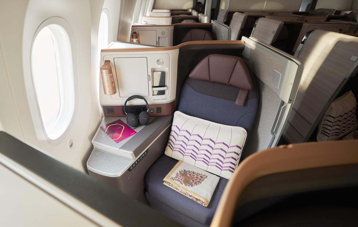 The design-forward business-class cabin features a reading lamp with the Indian jaali design that lends a chic, lounge-like vibe to the space 