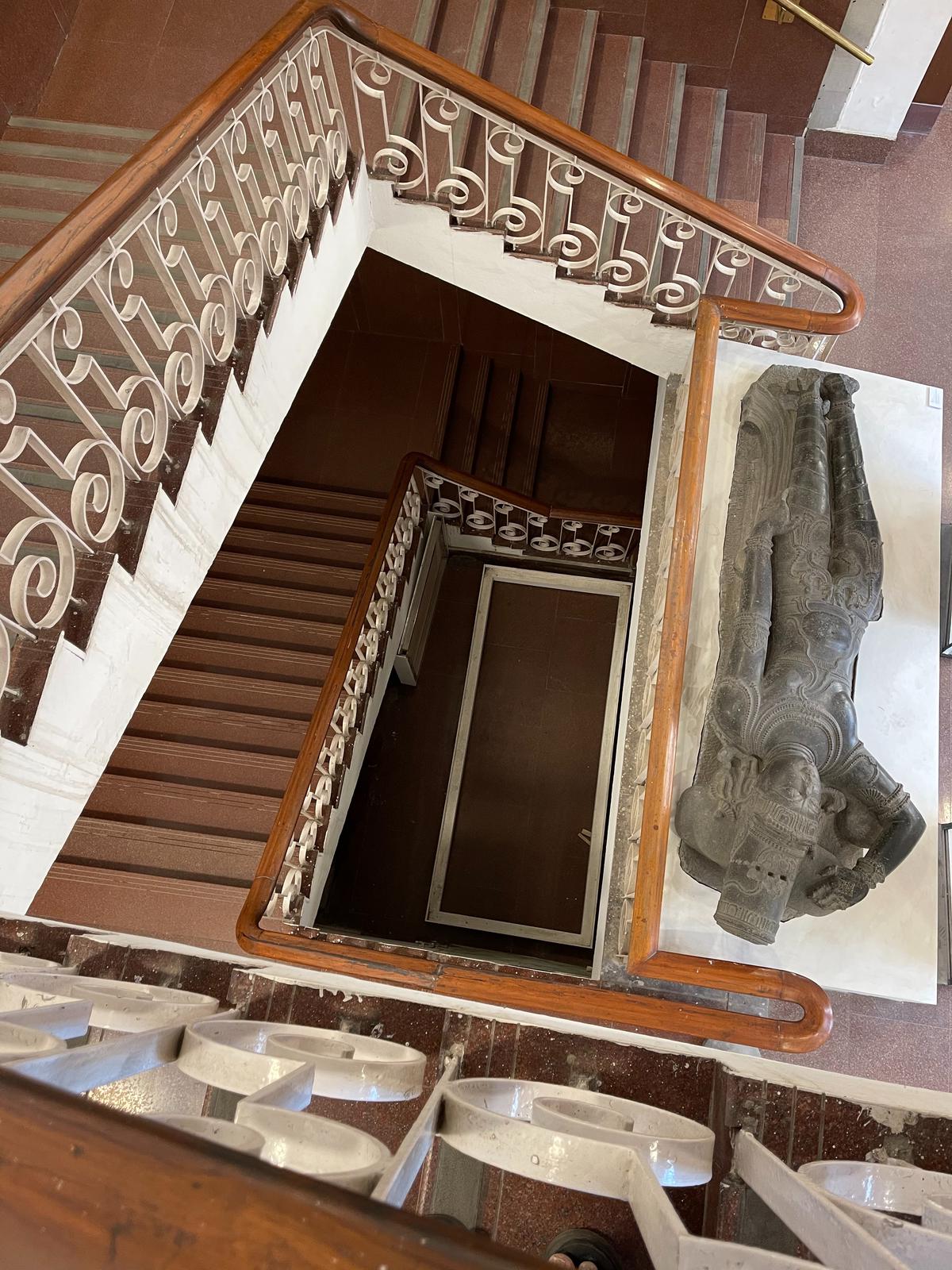 Staircase detail, with a Vishnu sculpture on the landing
