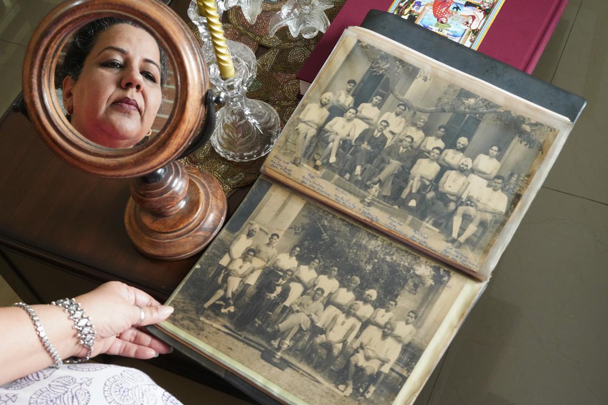 Sunaini, shows the album which has a picture of her grandfather with Balraj Sahni; Photo: Sandeep Sahdev