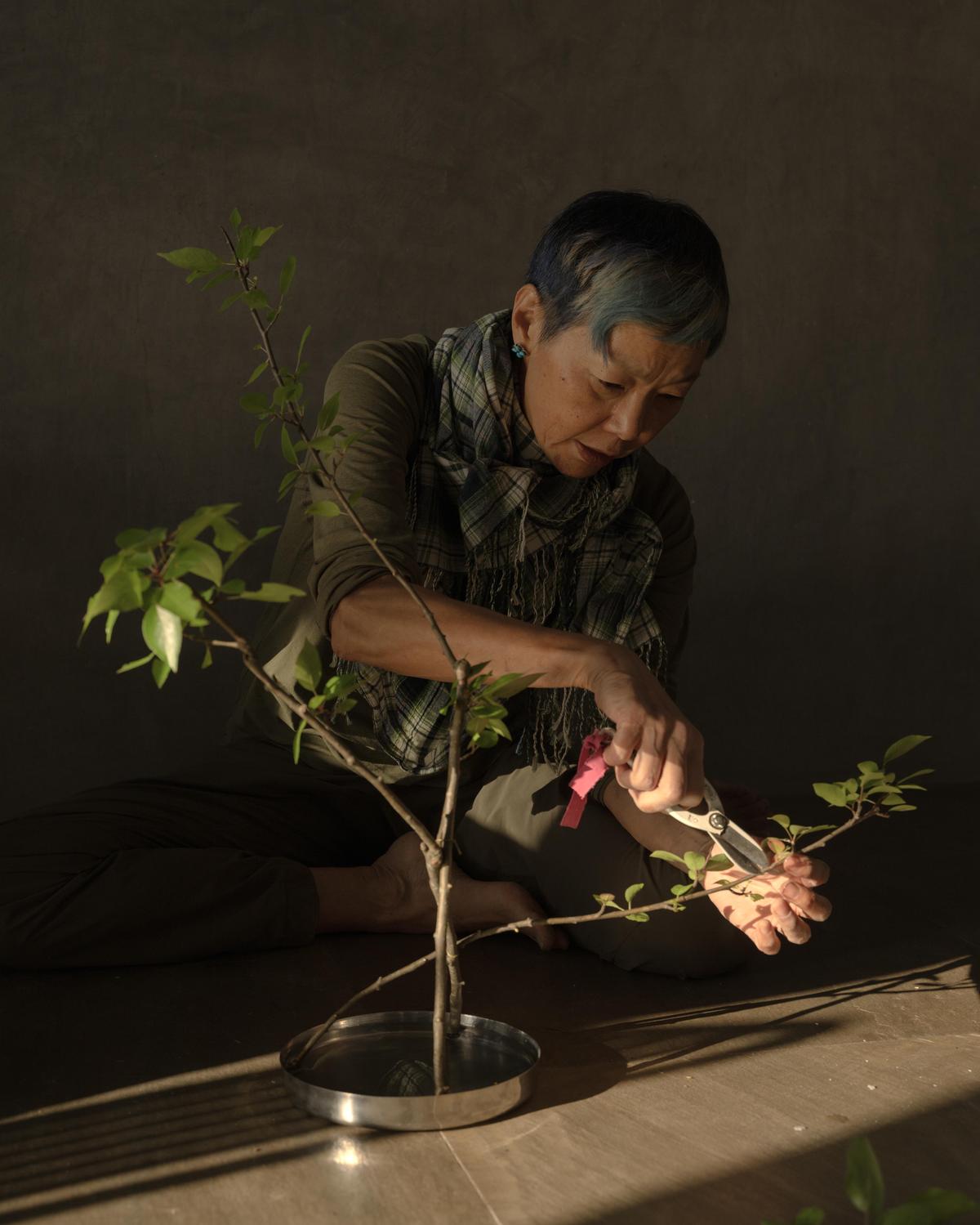 Artist Eri Iwase demonstrating the practice of Ikebana.