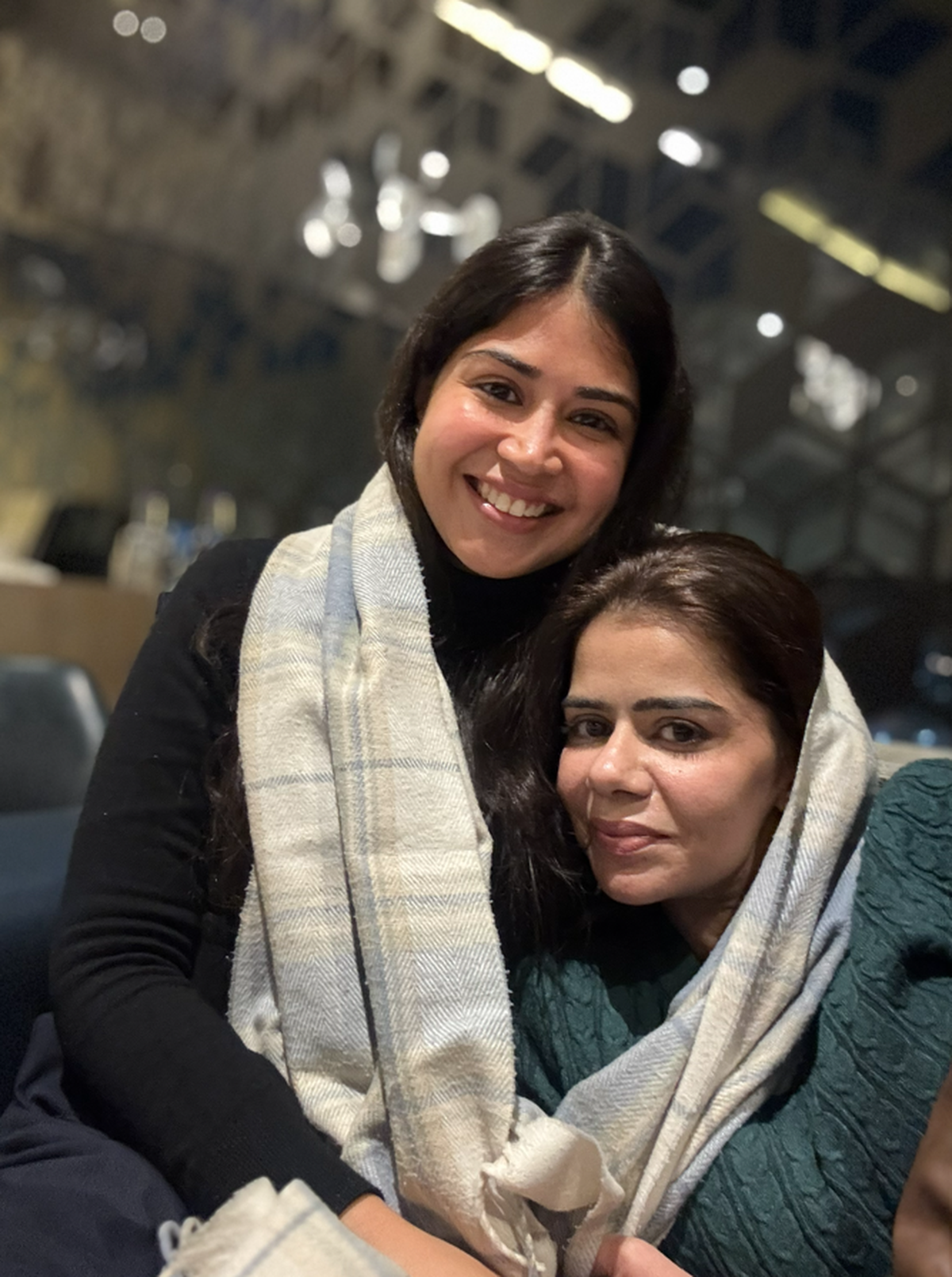 The writer and her sister with the shawl