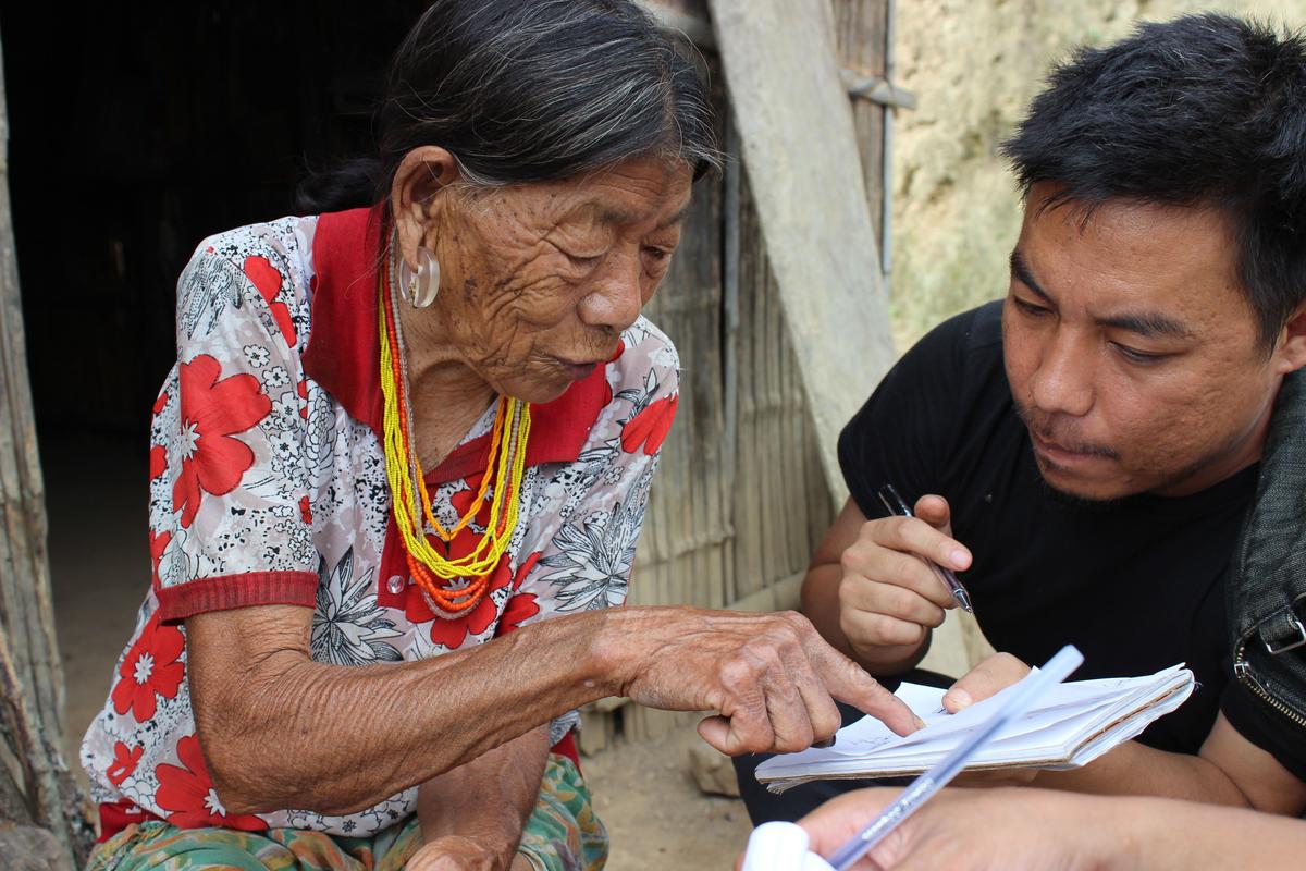 Mo Naga learning tattoo patterns and their stories from a village elder in Nagaland’s Tuensaang district 