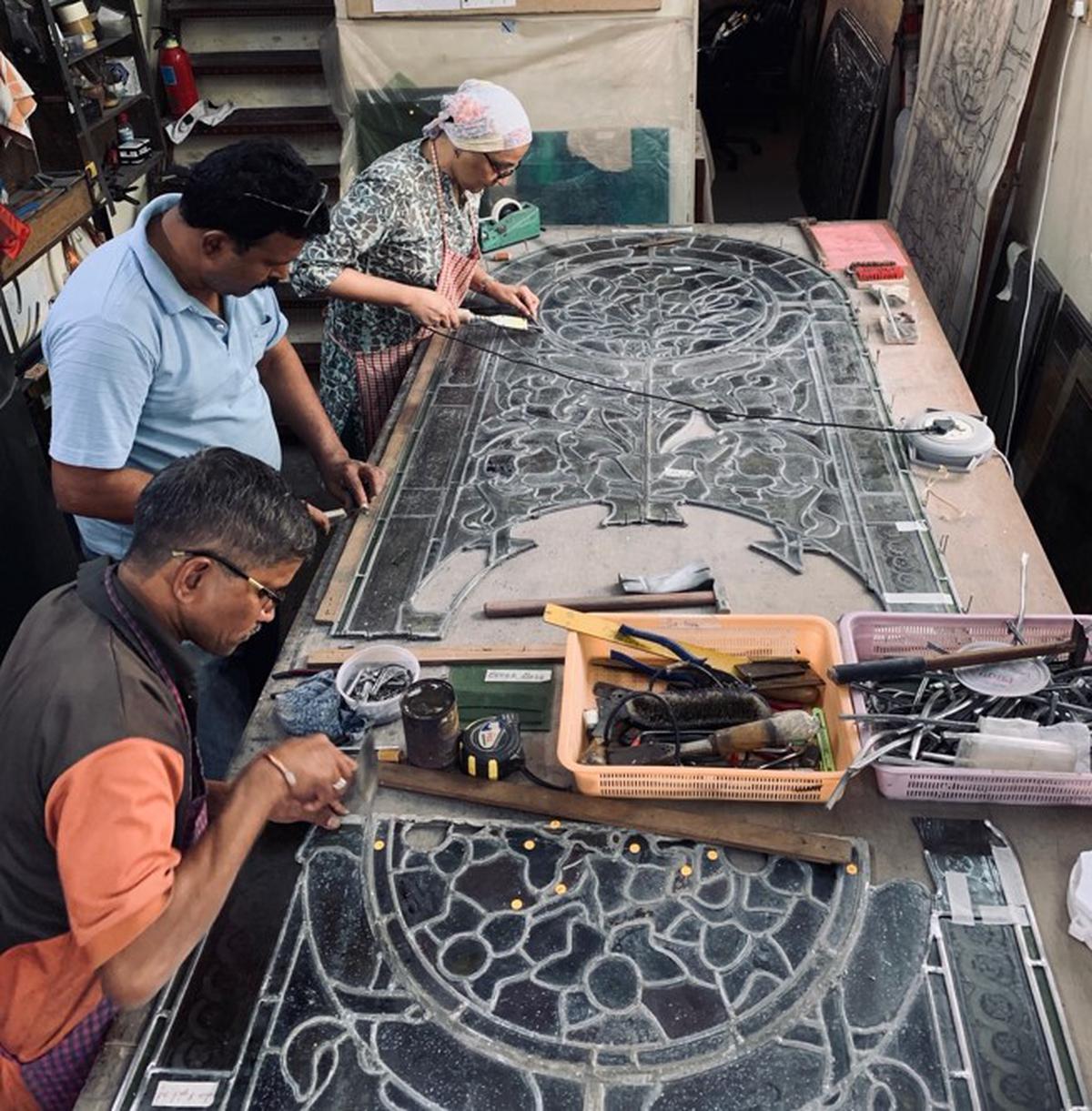 Craftsmen working on the synagogue’s stained glass windows