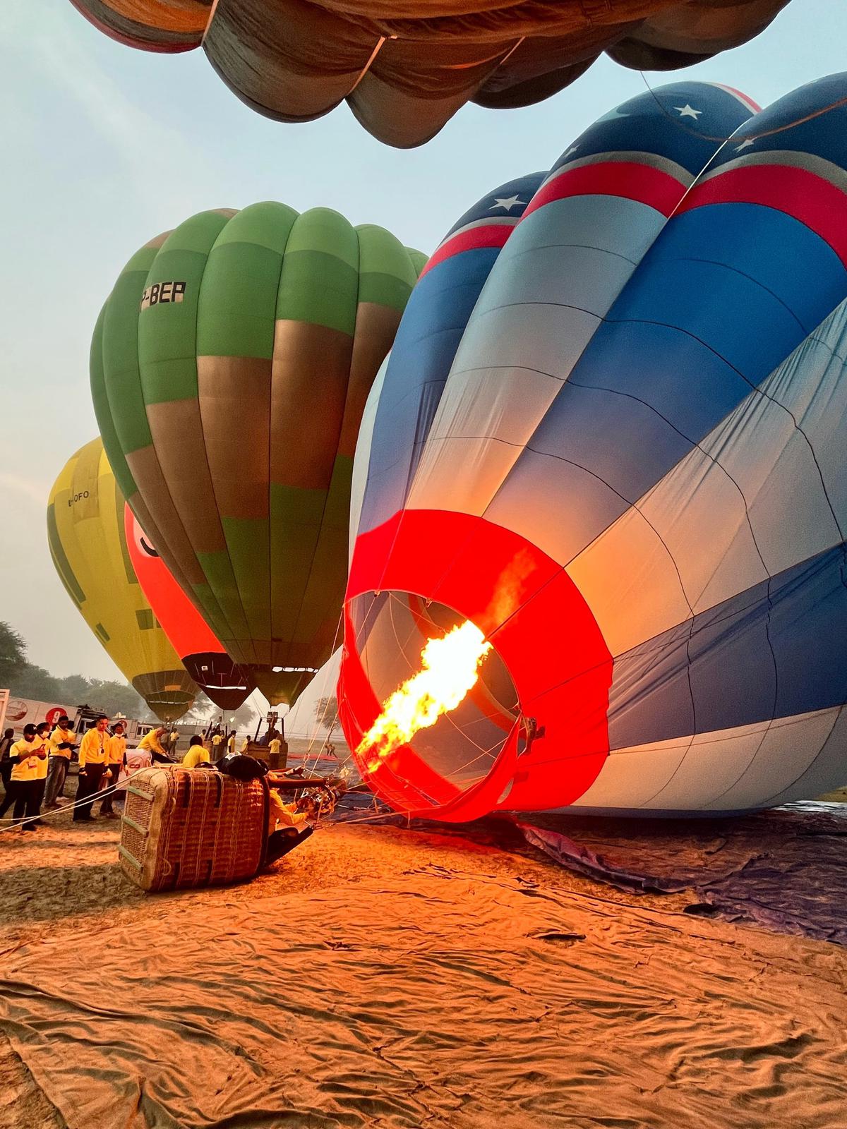 Captain Sangram Prakash Pawar fills hot air in the balloon just before the flight 