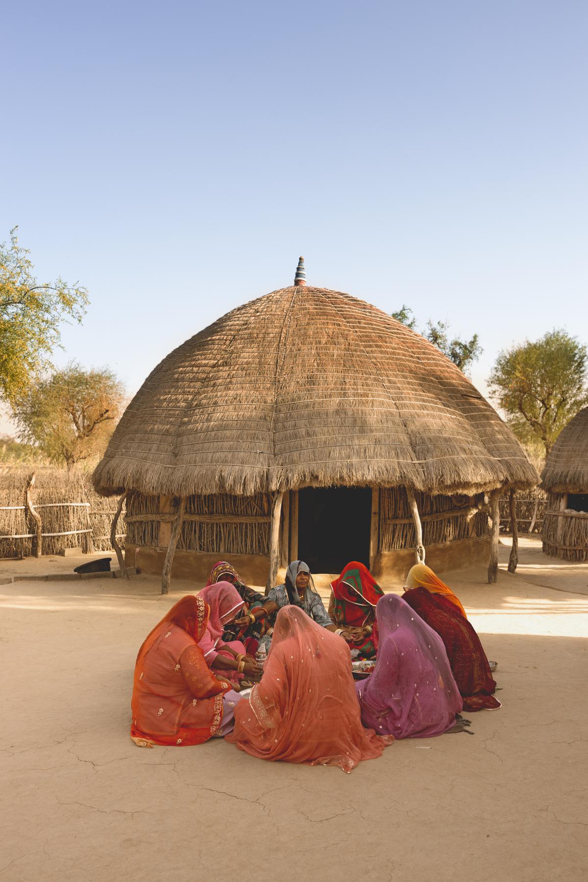 At a hamlet near Barmer, women engage with beadwork