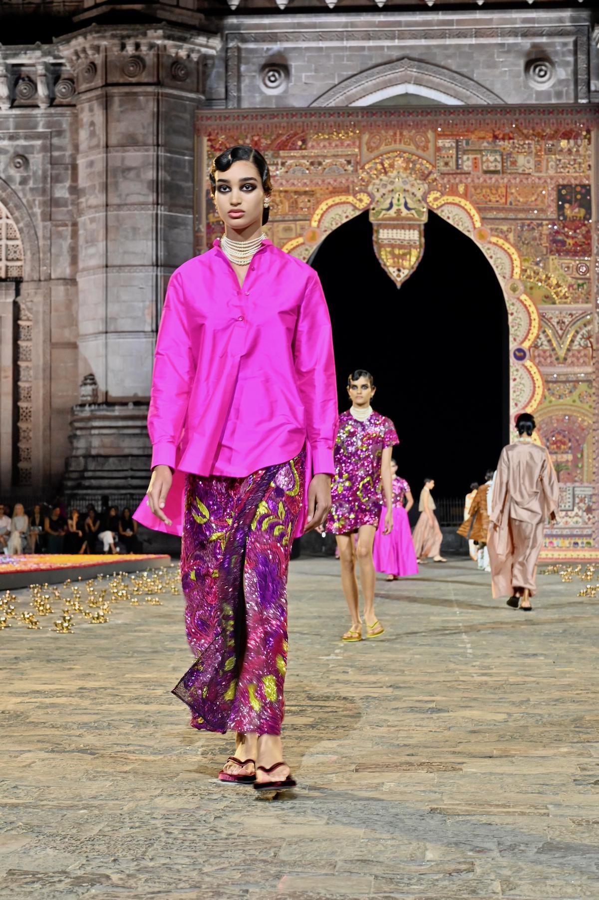 A model walks the runway during the Dior Pre-Fall 2023 show at the Gateway of India