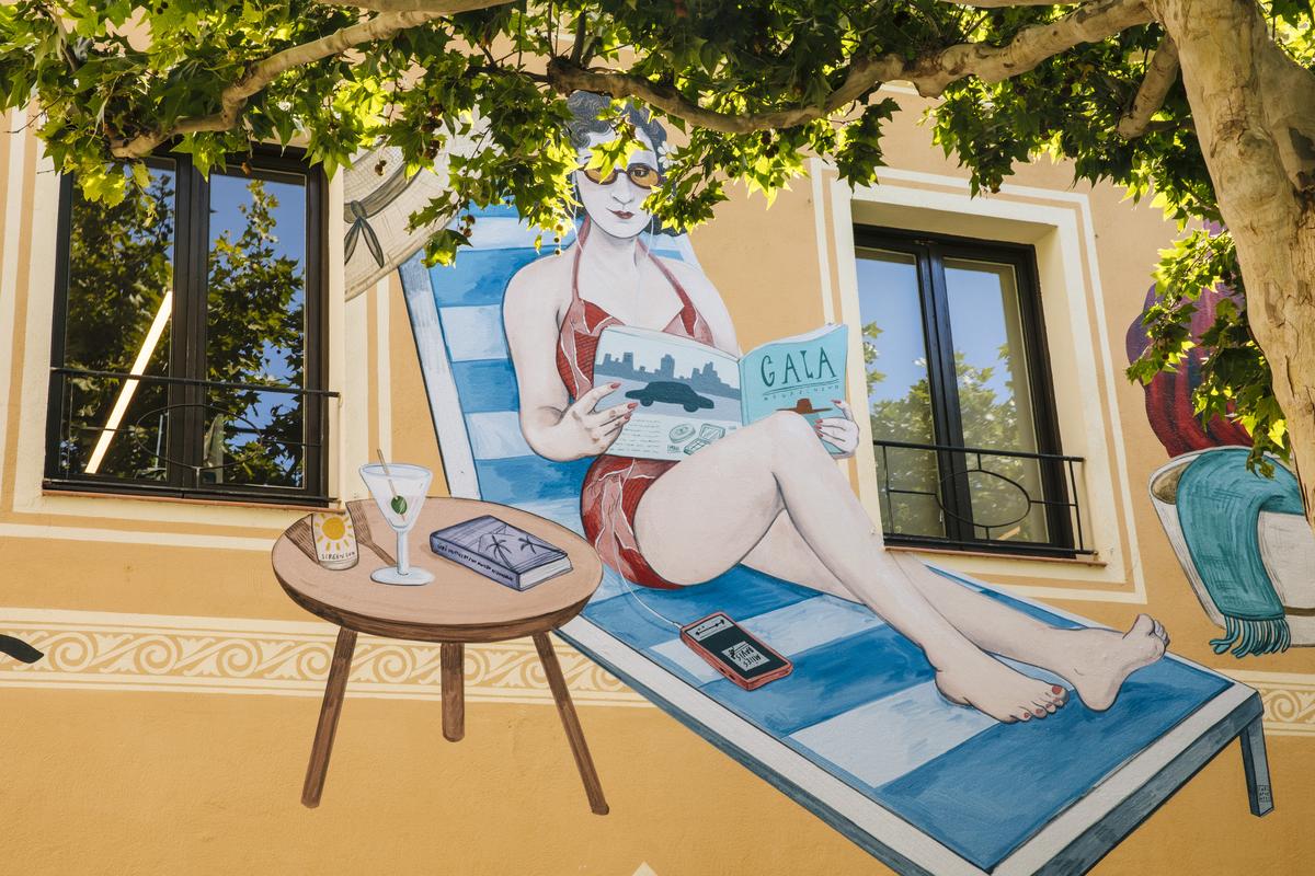 A painting by Carla Fuentes of Gala Dalí at La Roca Village