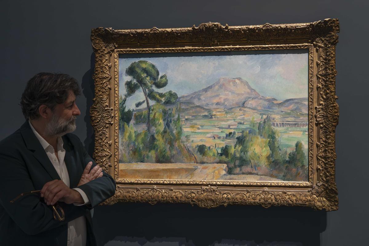 Chief curator Jérôme Farigoule with Paul Cézanne’s Mont Sainte-Victoire