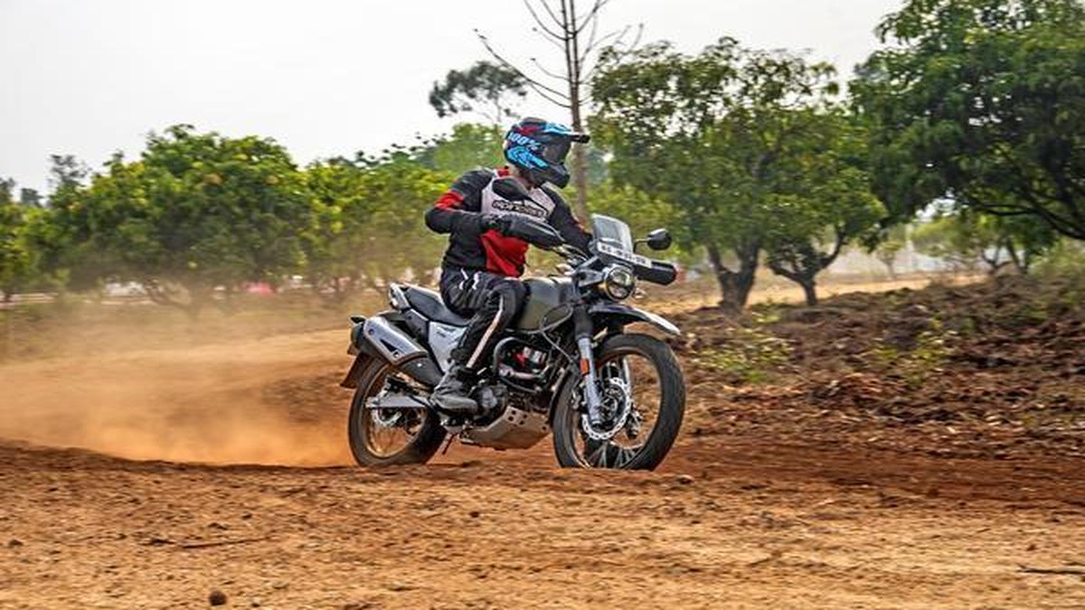 The Hero XPulse 200 sports an MXstyle front fender, big spoked wheels and upswept exhaust The