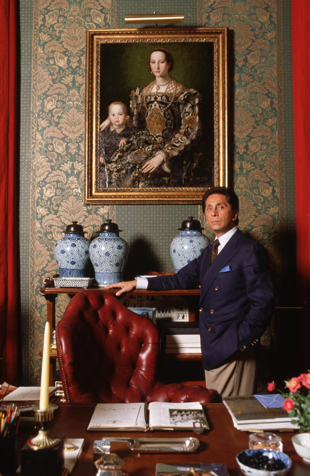 Valentino stands by a desk in his atelier in Rome Valentino stands by a desk in his atelier in Rome