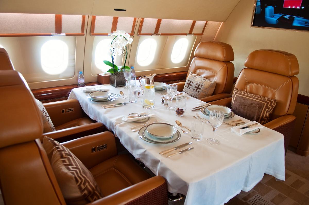 Dinner served in luxurious jet airplane