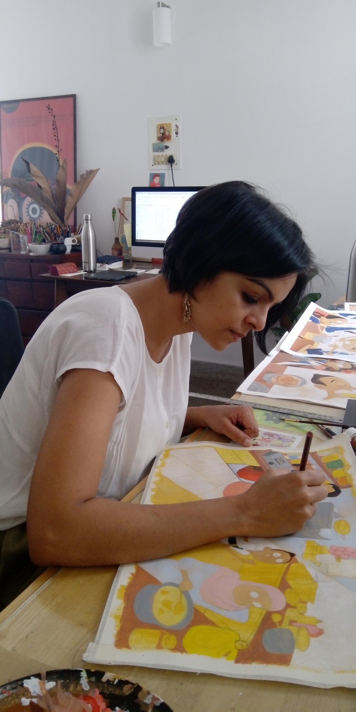 Priya Kuriyan aan haar bureau