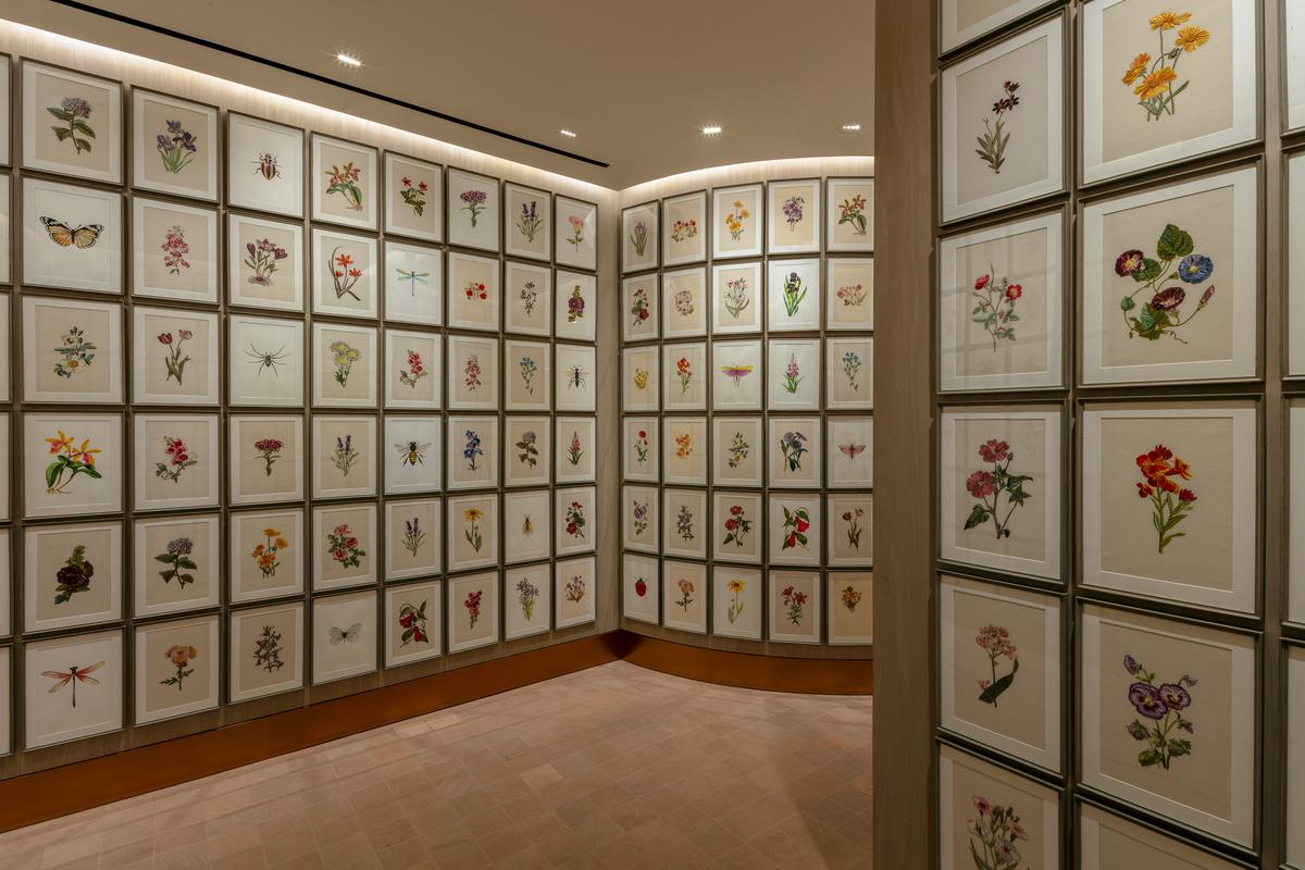 From floor to ceiling, every inch of space is covered by framed artwork From floor to ceiling, every inch of space is covered by framed artwork