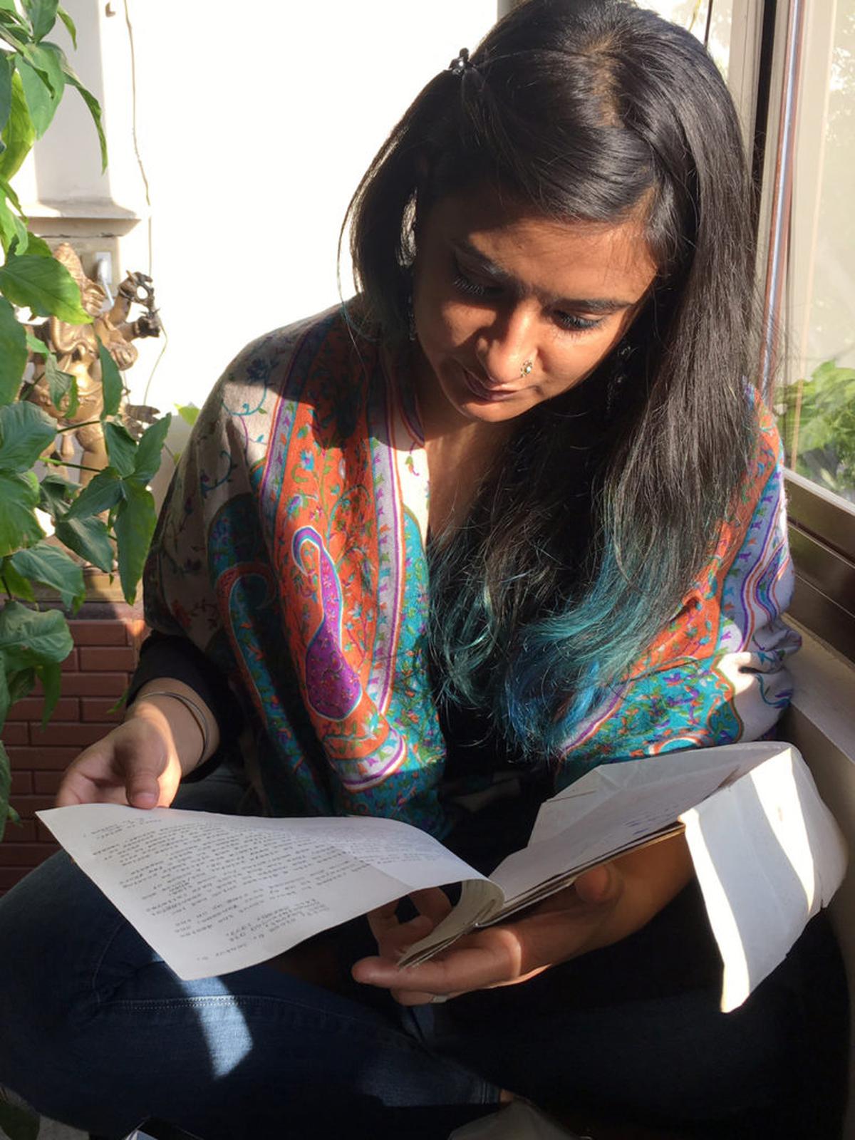 Navadha Malhotra scrutinizes her grandfather's documents;  Photo: Special Arrangements