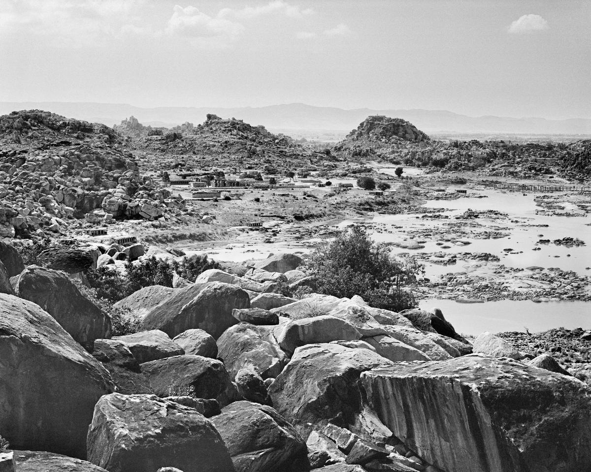 The dramatic expanse of the rocky landscape of Tungabhadra valley. The remains of an extraordinary architectural complex defines this land, as ruins of temples, pavilions and structures.