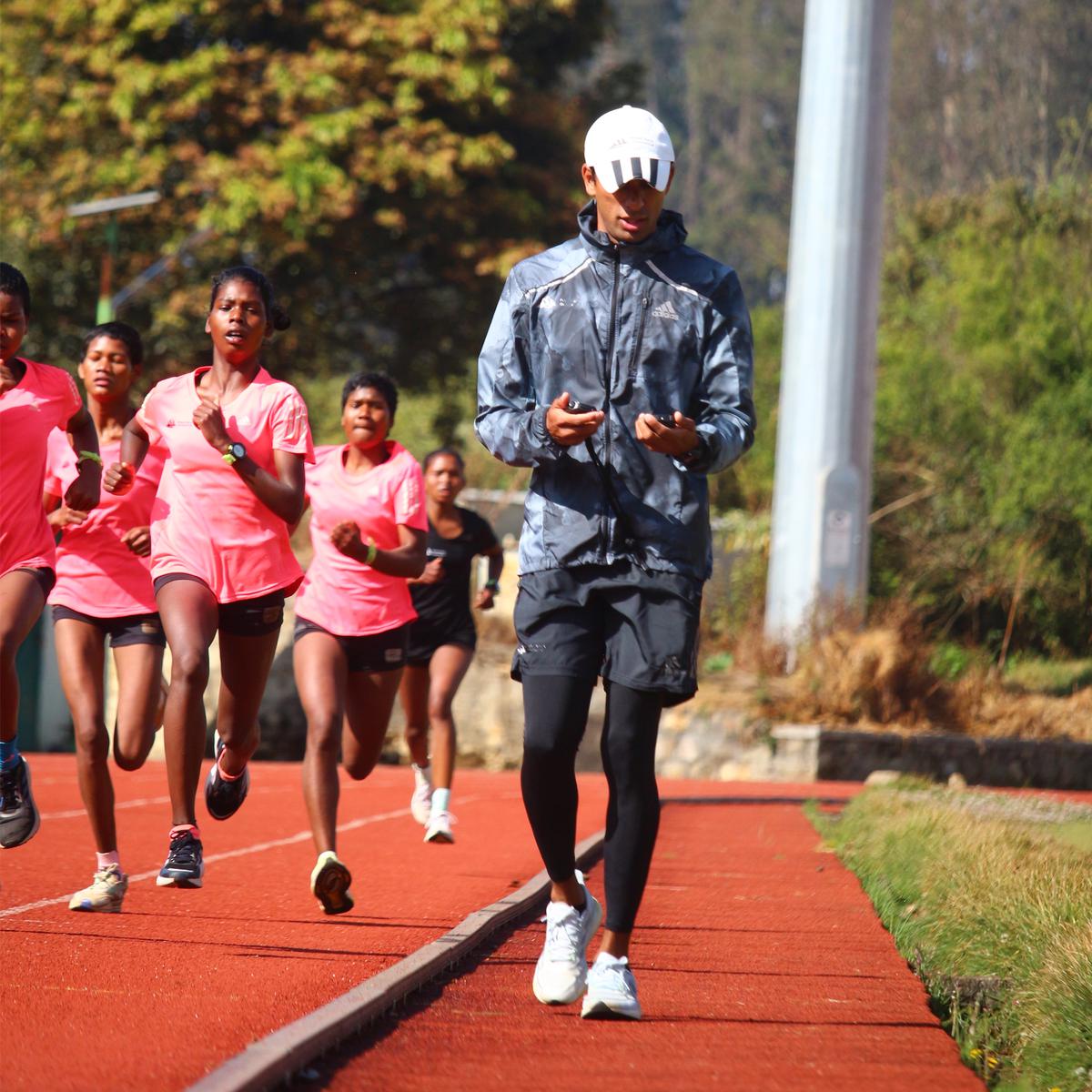 Karan Singh with his athletes in training at the Indian Track Foundation