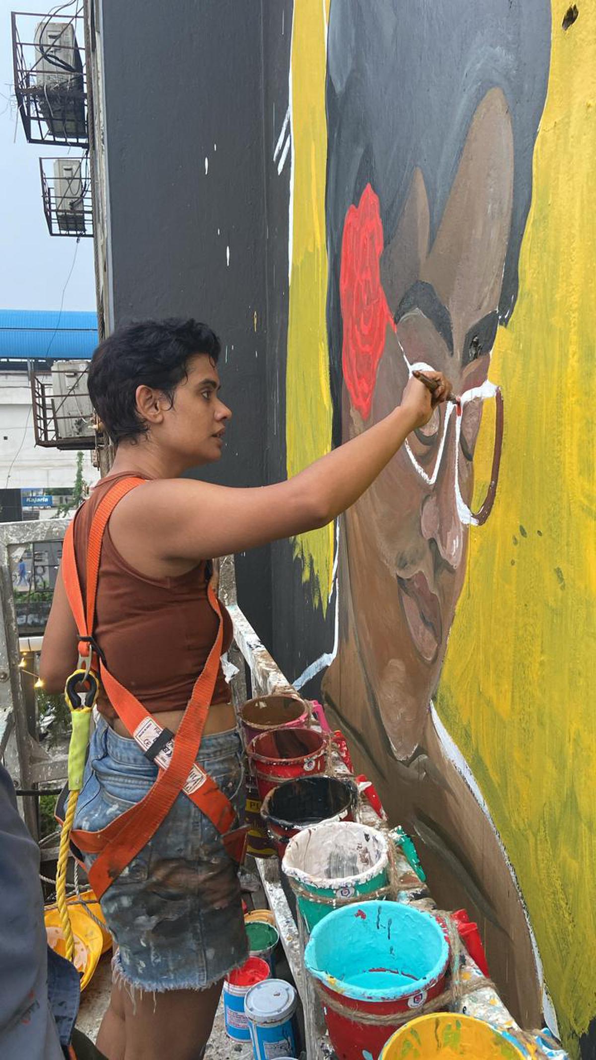 Nandini Moitra working on the mural