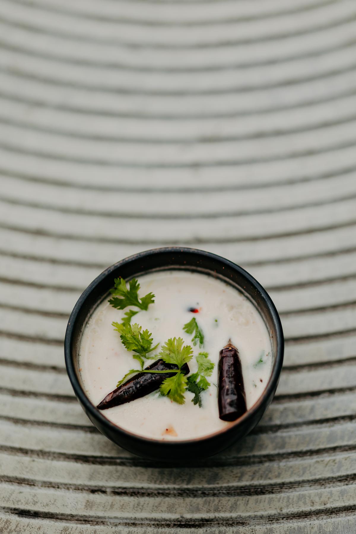 Coconut and galangal soup comes with mushrooms for vegetarians and with chicken for meat eaters