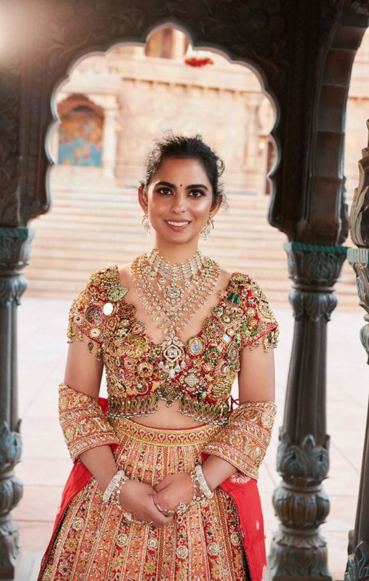 Isha Ambani in a Jadau blouse with heirloom jewellery, styled by Anaita Shroff Adajania, at the Ambani-Merchant wedding Isha Ambani in a Jadau blouse with heirloom jewellery, styled by Anaita Shroff Adajania, at the Ambani-Merchant wedding