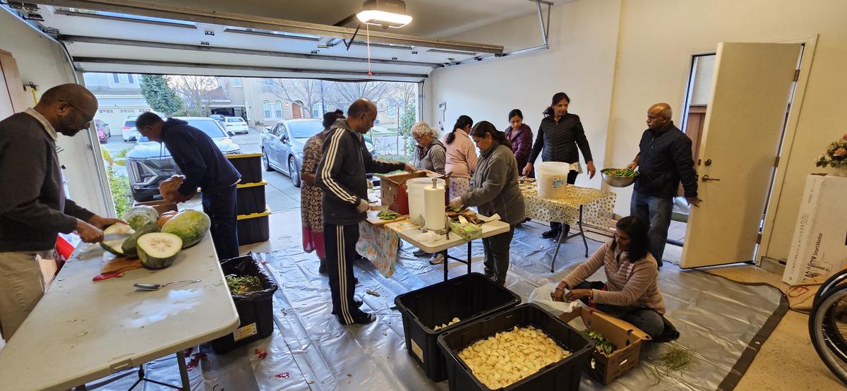 Volunteers help prep for the banana leaf meals 