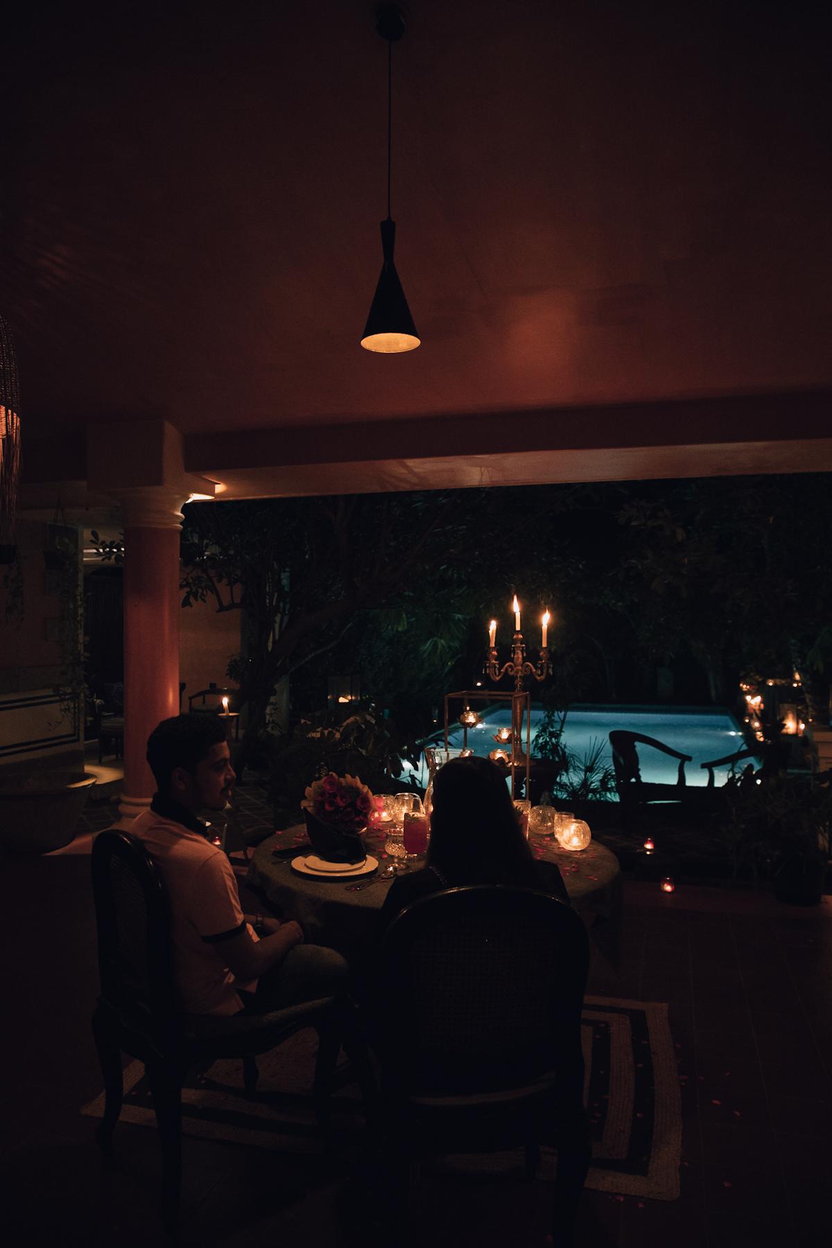 A candle lit table at Asvah