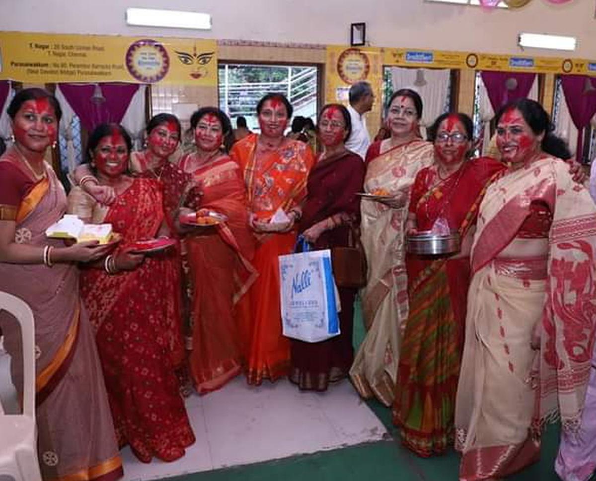 Women taking part in puja rituals