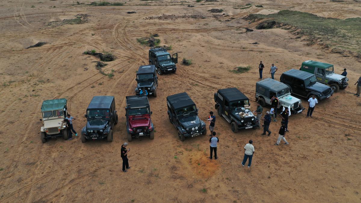 An aerial view of SUVs, ahead of an off-roading session.