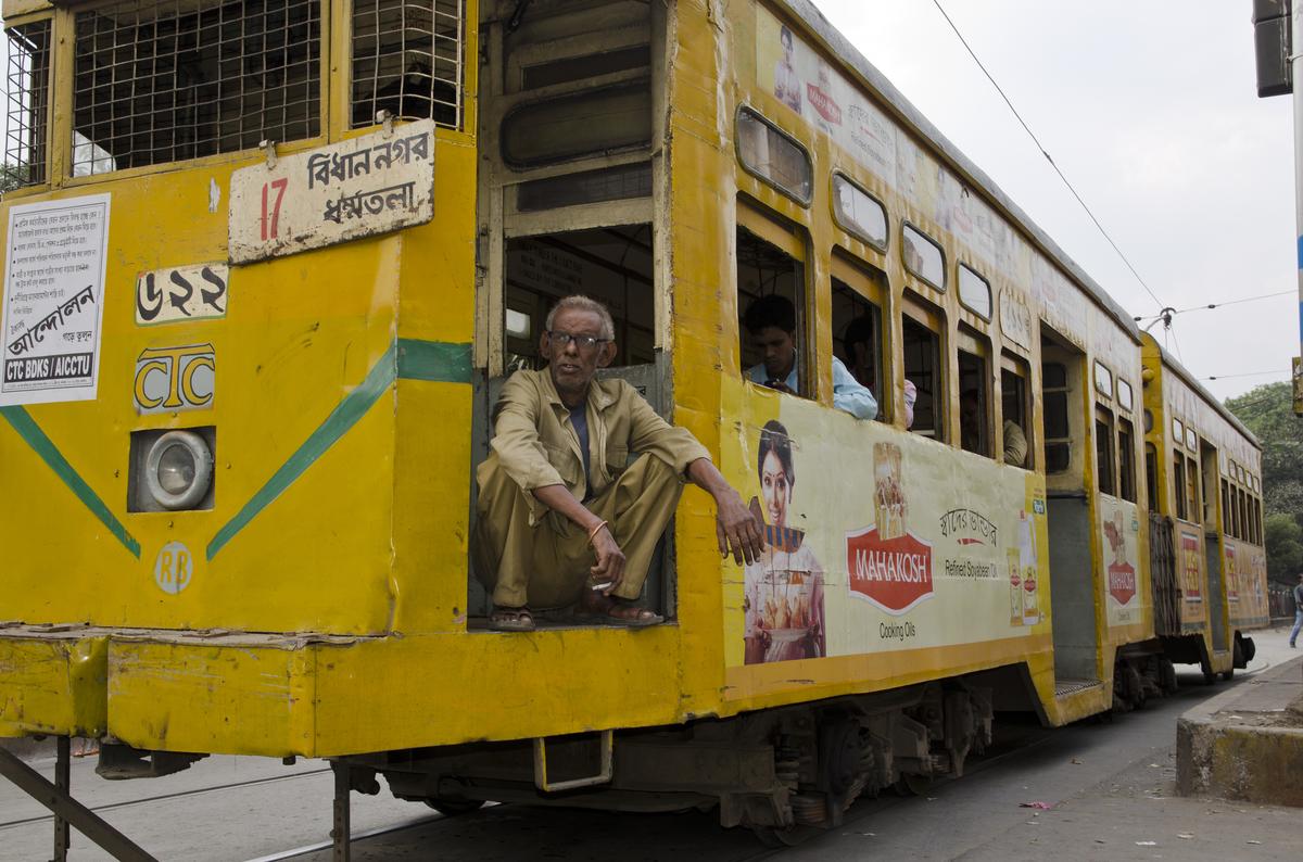 A driver rests in an old Kolkata tram 