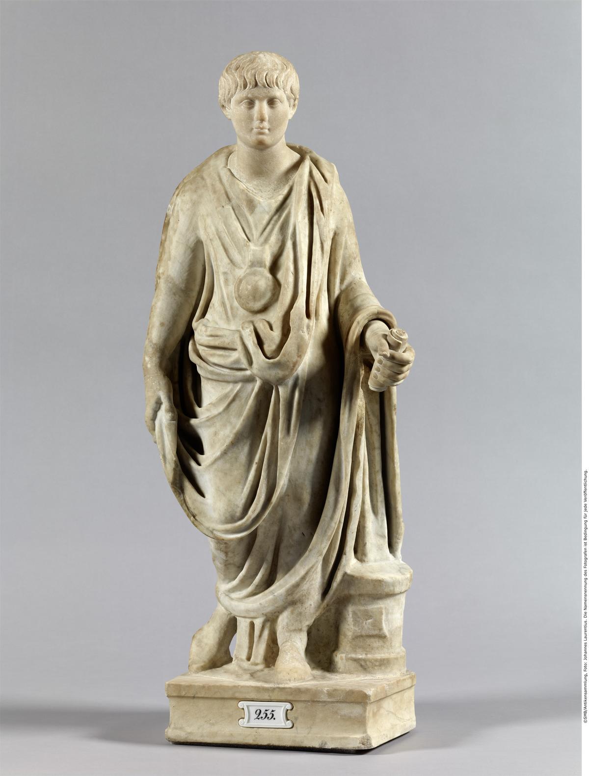 funerary statue of a roman boy