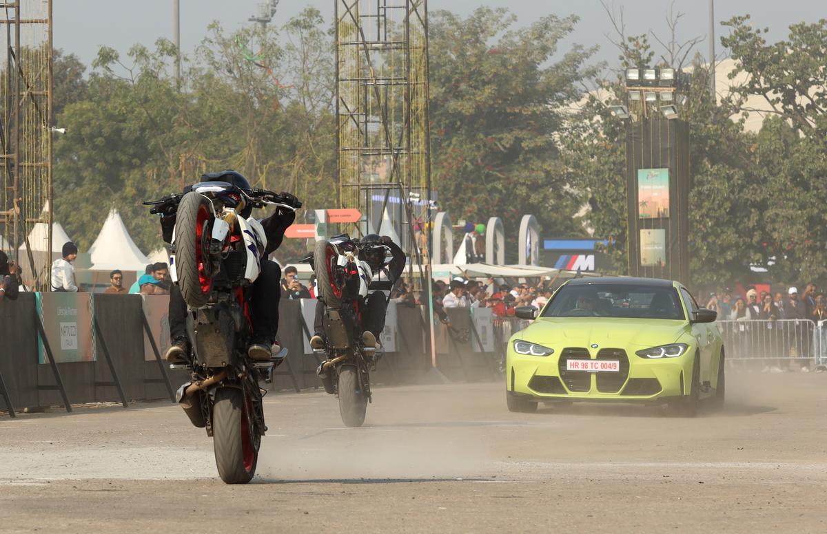 Expert stuntmen doing a wheelie on BMW Motorrad bikes