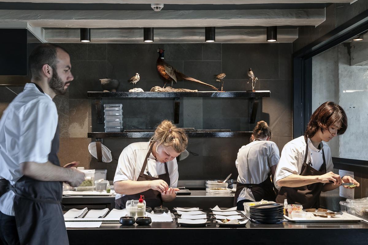 Daniel Giusti and kitchen staff working at Noma restaurant, Copenhagen, on May 9, 2014