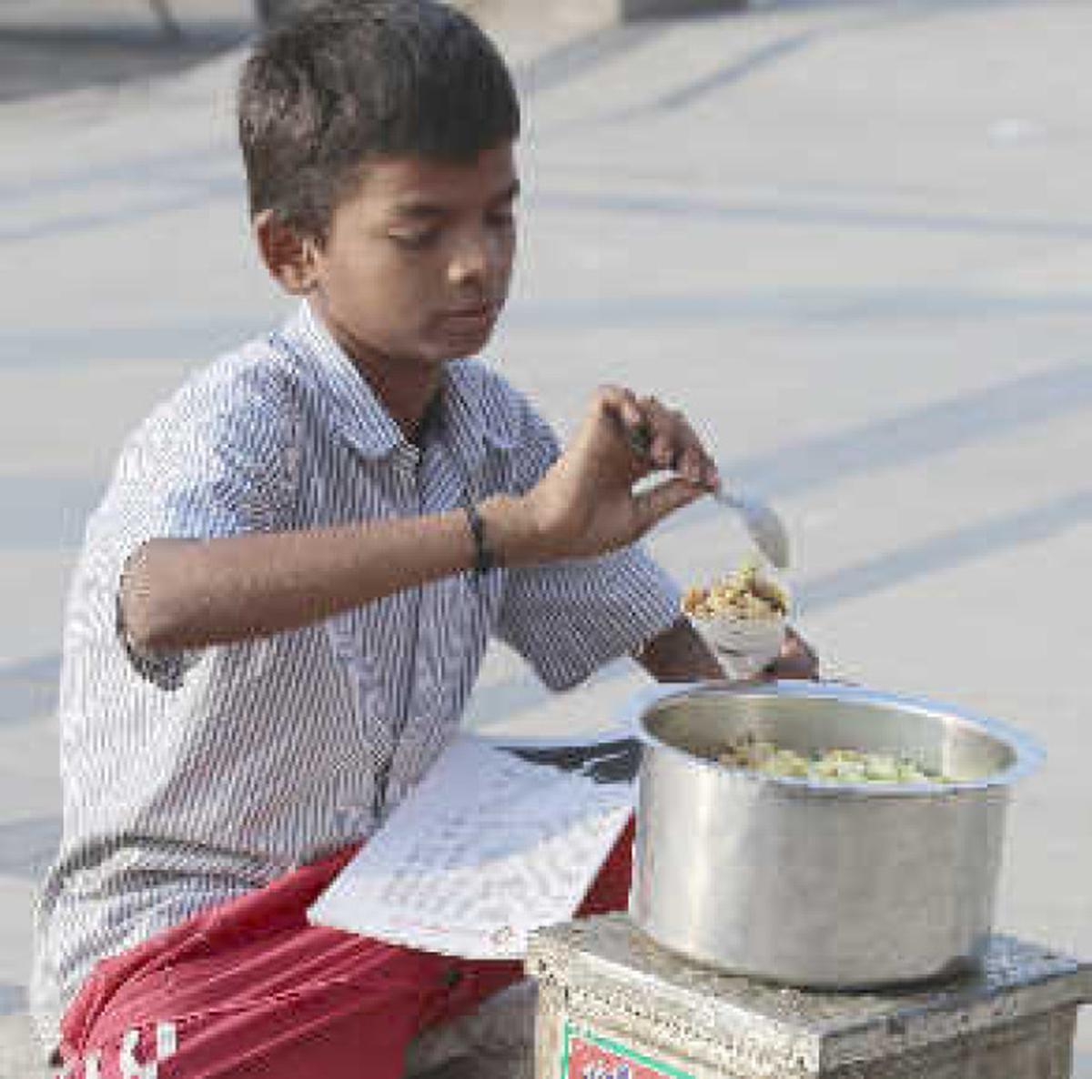 A young boy selling sundal on the beach in Chennai.