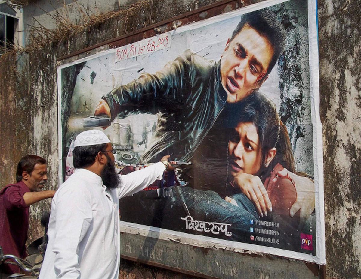Protestors tearing a poster of Kamal Haasan’s controversial movie ‘Vishwaroopam’ in Mumbai. File