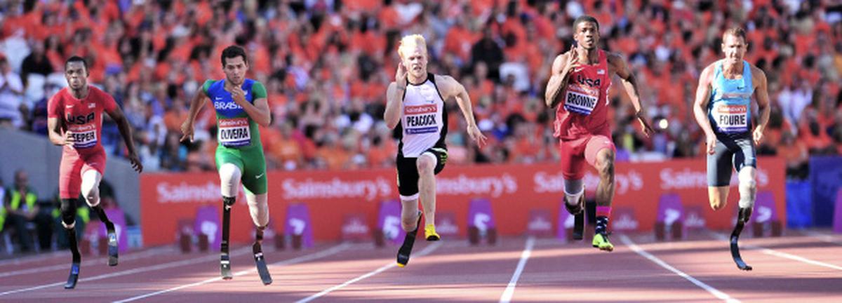 Blake Leeper of the US (L) Alan Oliviera of Brazil (2-L), Jonnie Peacock (C) of Great Britain Richard Brownie (2-R) of the US and Arnu Fourie of Russia compete in the mens T43/44 100 metres event during the International Para Challenge in the London Anniversary Games at the Olympic Stadium in London on July 28, 2013. AFP PHOTO/GLYN KIRK