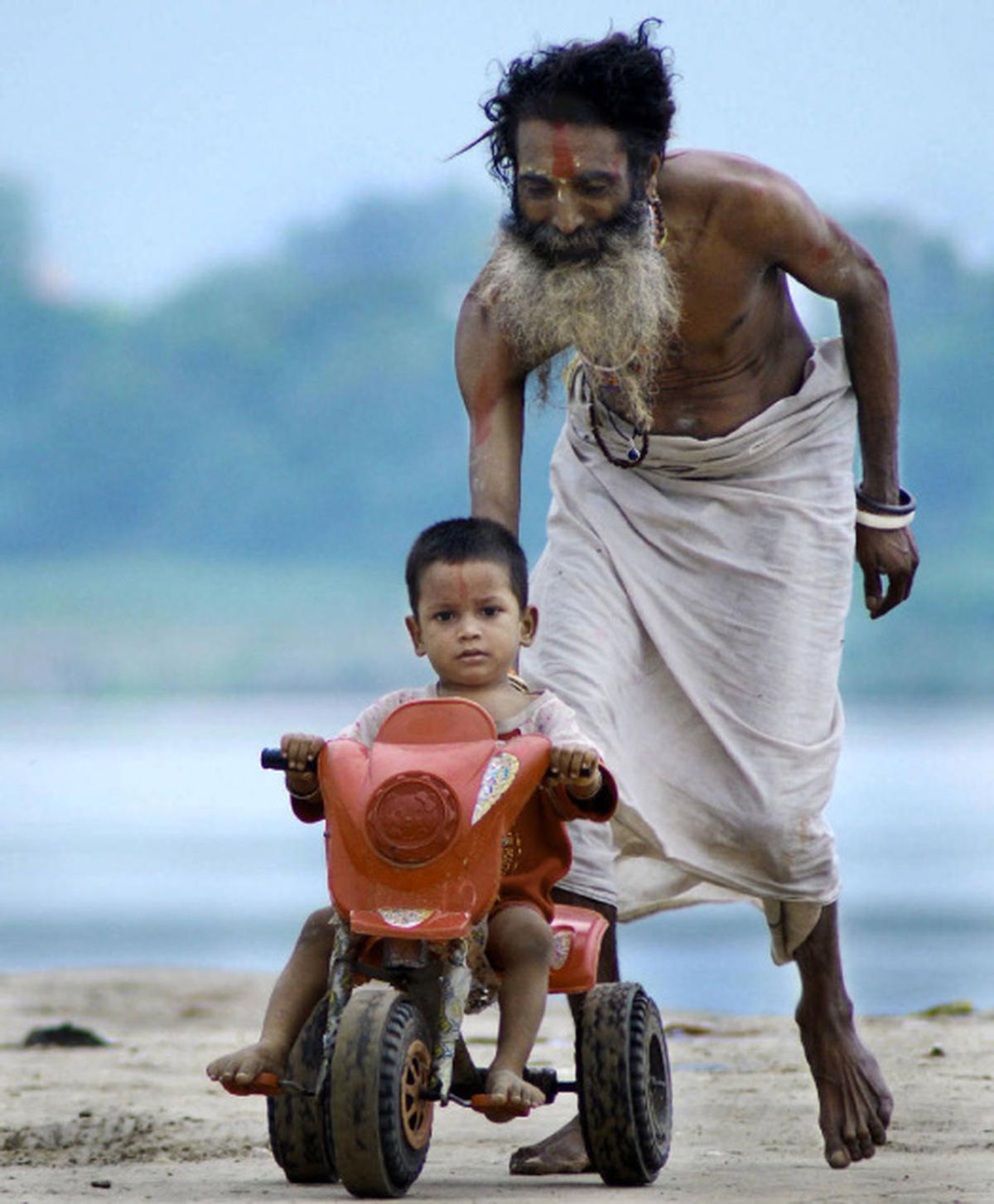 A sadhu and his son - The Hindu