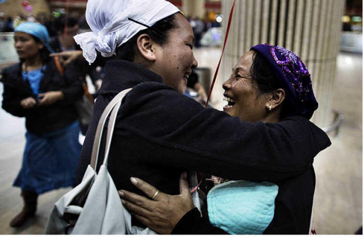 A Jewish immigrant of the Jewish Bnei Menashe community in Manipur, northeast India, is met by family members as she arrives at  Ben Gurion airport near Tel Aviv, on December 24, 2012. Fifty members of this Indian Bnei Menashe community arrived to join the 1,700 who already live in Israel. The Bnei Menashe is a tiny community that claims to have descended from the Manasseh — one of the Biblical “lost tribes” of Israel, who comprise of around 7,200 members of the Kuki-Chin-Mizo tribe who live in the northeast Indian States of Mizoram and Manipur near the border with Myanmar.