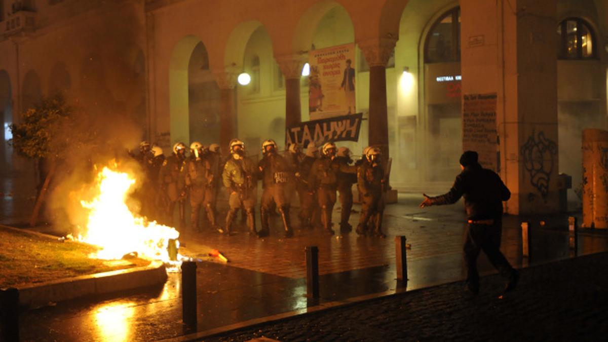 Greece passes new austerity deal amid rioting