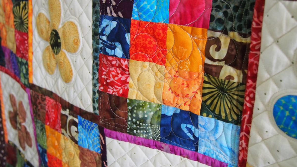Sunitha Santharam shares her love for quilting at a presentation