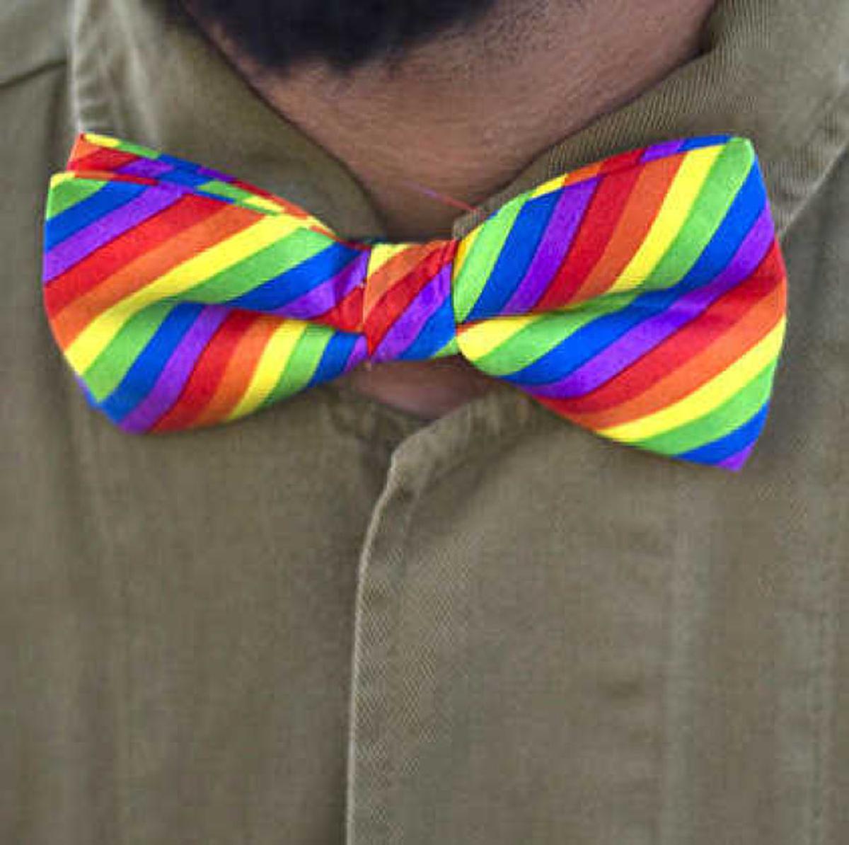 An Israeli reserve solider with a bow tie in the rainbow colors stands during a protest rally after the Gay pride march was canceled in Beersheba, Israel, Thursday, July 14, 2016, after Israel’s Supreme Court restricted the event’s route due to concerns of violence. 