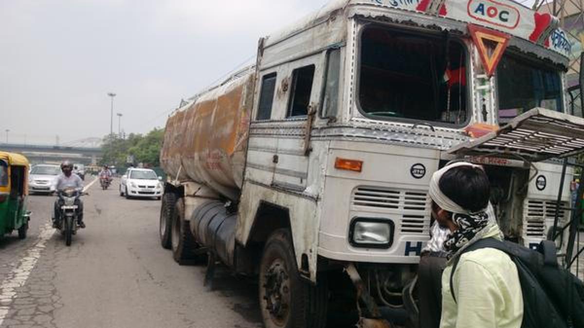 Fuel spills on road as tanker overturns The Hindu