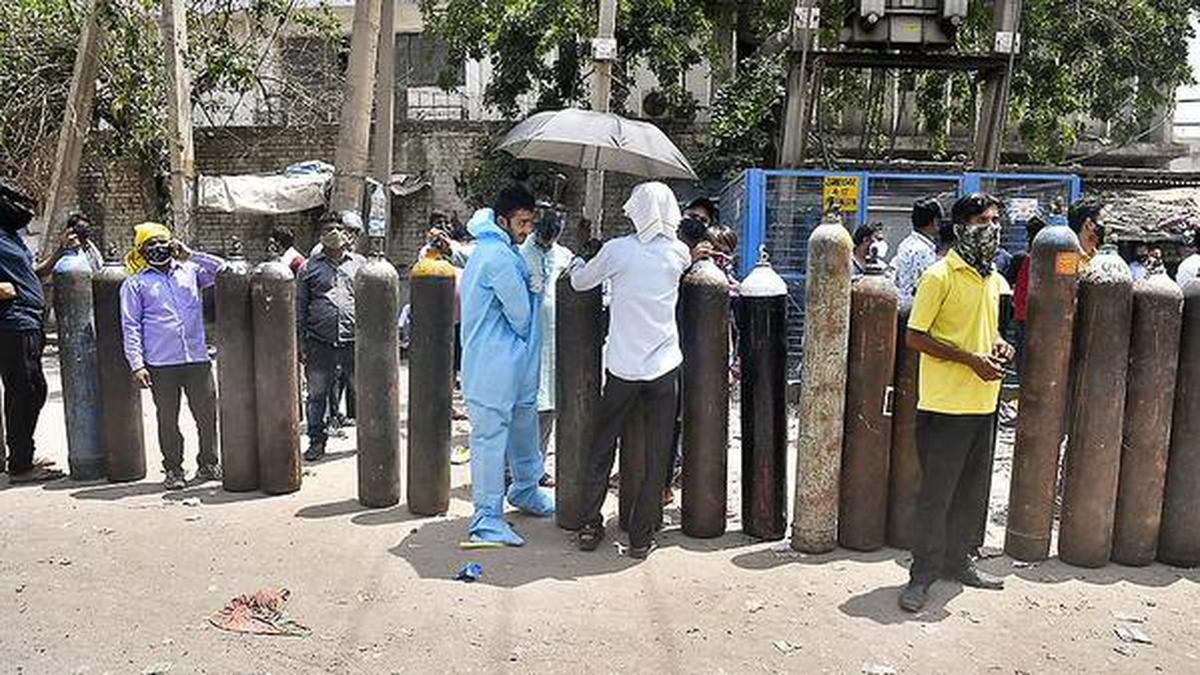 Kin line up to get oxygen refill as patients gasp for breath