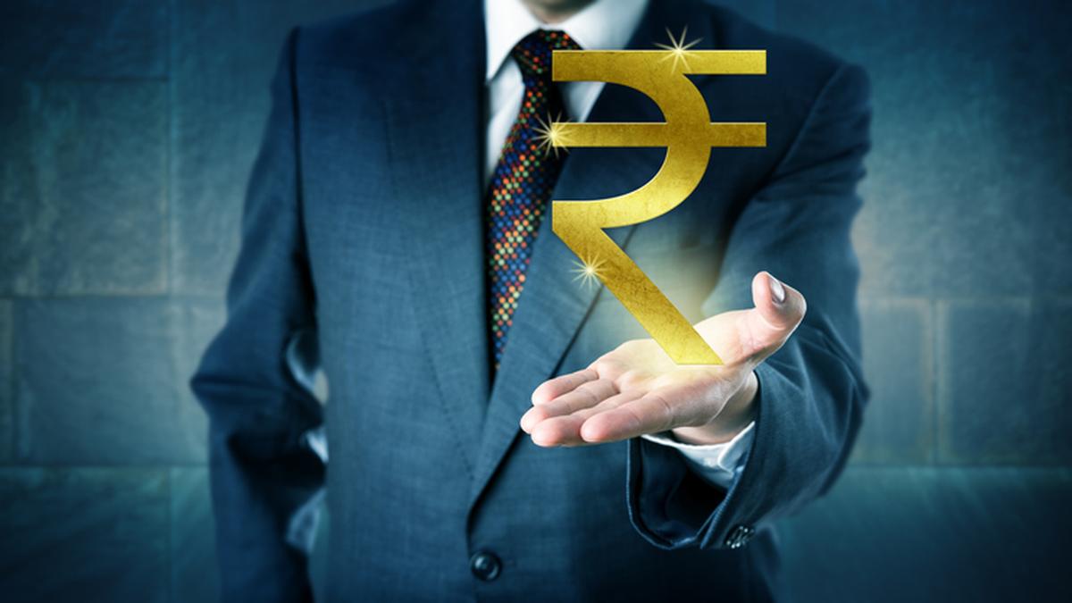 Rupee rises 14 paise to close at 90.33 against U.S. dollar