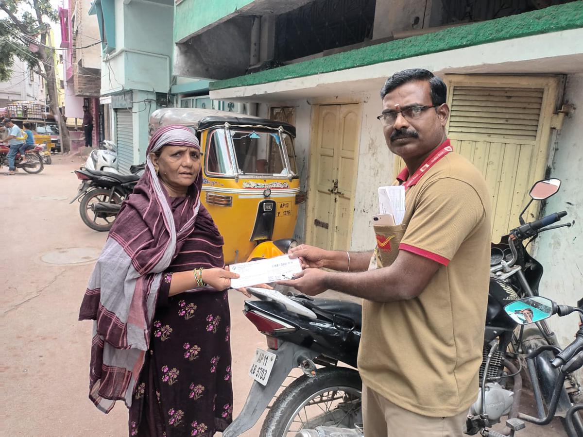 An elderly voter gets her EPIC card in Old City of Hyderabad